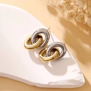 Minimalist punk style interlocking double circle stud earrings in gold and silver finish