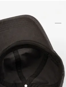 Detail of the cotton sweatband and interior stitching on a washed baseball cap