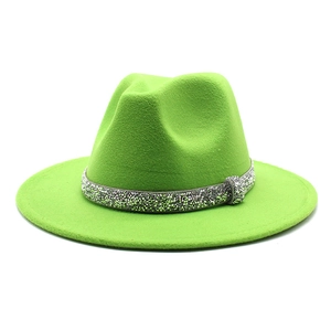 Close-up of neon green fedora hat featuring a sparkling silver sequin band detail