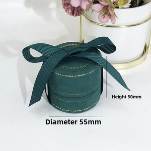 Dark green velvet round jewelry box with satin bow and gold dot trim, 55mm x 50mm size