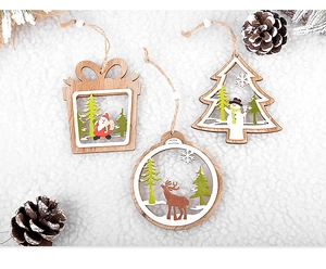 Detailed view of laser-cut wooden Christmas ornaments with Santa, elk, and snowman designs