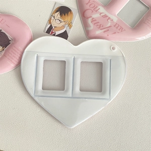 Close-up of heart-shaped white plastic dual-slot photo frame card holder pendant