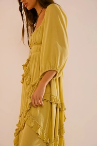 Detail view of mustard yellow ruffled dress with crinkle texture and lantern sleeves