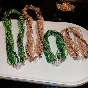 Detail of beaded multilayer necklaces and bracelets with crystal beads and magnetic clasp