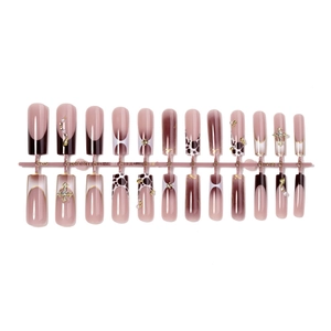 Long coffin press-on nails with leopard print, 3D metal crosses, and pearl accents