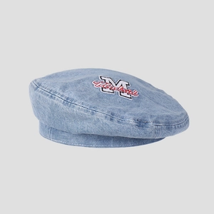 Detail of light blue denim beret featuring vintage Madrid letter embroidery and texture
