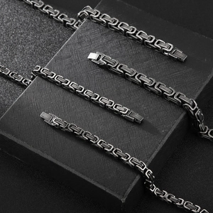 Detail of black Byzantine chain links showing intricate interlocking craft on dark display