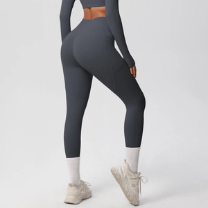 Detail view of high waist yoga leggings with side pockets in charcoal grey finish