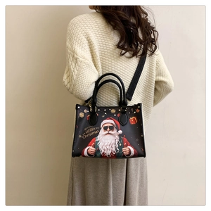 Close-up of Santa Claus print tote bag with adjustable Merry Christmas shoulder strap