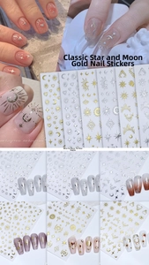 Detail showing gold and silver star moon nail stickers with metallic laser effect