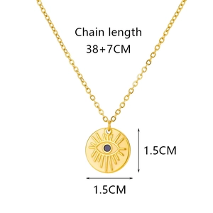 Detailed view of evil eye disc pendant necklace with 38+7cm chain length measurement