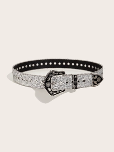 Detail of western style black belt with silver sequins and engraved metal buckle