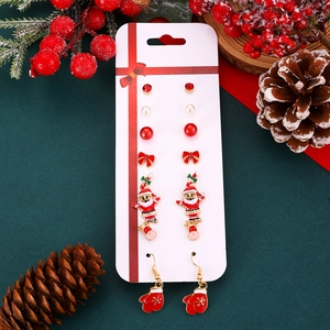 Detail of 6-pair Christmas stud earrings set with Santa, tree, and snowflake charms