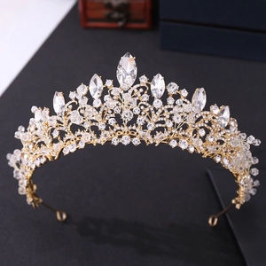 Macro detail of bridal crown featuring hand-beaded crystals and rhinestones on gold alloy