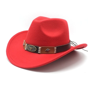 Detail of red wool felt cowboy hat with leather band and metal bull head buckle