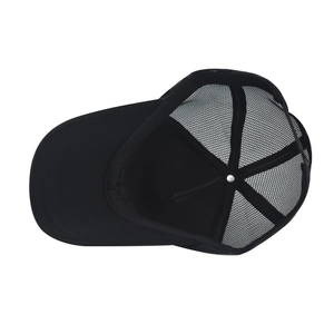 Detail view of the black trucker hat interior with breathable mesh and sturdy stitching