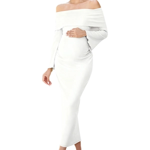 Elegant white off-shoulder maternity maxi dress with long sleeves for photo shoots