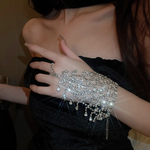 Detailed view of silver multi-layer tassel bracelet ring with sparkling rhinestones