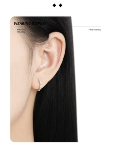 Close-up of S925 sterling silver hoop earring with vertical textured geometric grooves