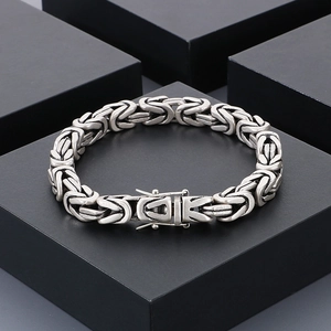 Detailed view of silver Byzantine chain bracelet with box clasp on black cube