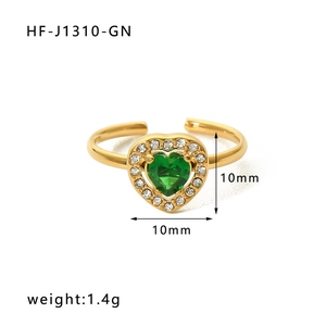 Detailed macro view of the 10mm green heart zircon stone on a golden stainless steel ring