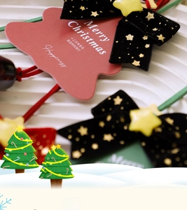 Macro detail of Christmas hair accessories with velvet bows and star ornaments