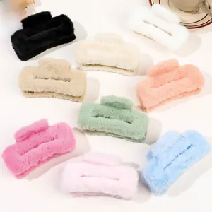 Macro shot of large plush hair claws in various colors for autumn and winter hair styling