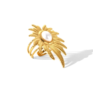 Gold stainless steel ring featuring a white pearl and tropical leaf texture on white background