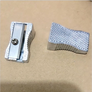 Macro detail of silver aluminum pencil sharpener with diamond non-slip texture