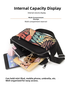 Detail of waterproof nylon crossbody bag with leaf print showing multi-compartment storage