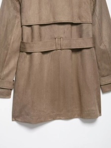 Detail of mocha faux suede trench coat featuring storm flap and adjustable waist belt