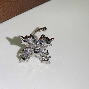 Silver navel ring with clover design featuring four teardrop-shaped zircon stones