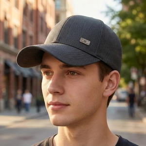 Dark grey cotton baseball cap with metal WS tag for casual outdoor wear and travel