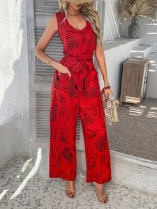 Detail of red floral sleeveless jumpsuit with side pockets and matching waist belt