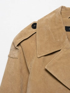 Detail of camel faux suede jacket featuring shoulder epaulets and classic lapels