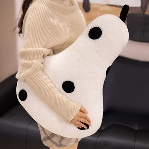 Plush pear-shaped pillow in white sherpa fabric with black polka dots for home decor