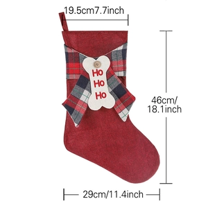 Red linen Christmas stocking with plaid bow and bone ornament, 18.1 inch height sizing