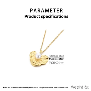 Detailed macro view of gold heart-shaped irregular pendant with pearl and stainless steel chain