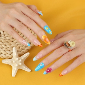 Short almond press-on nails with 3D tropical flowers and ocean wave patterns
