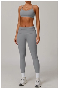 Macro view of grey yoga set featuring high-waisted ruched waistband and supportive bra