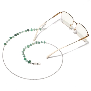 Detail of silver glasses chain with green aventurine natural stones and non-slip rubber loops