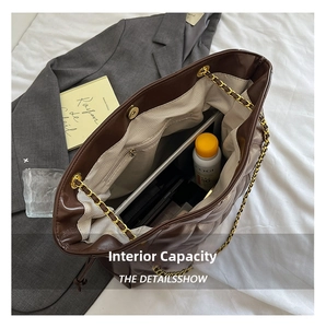 Top view of spacious quilted tote bag interior with pockets for laptop and essentials