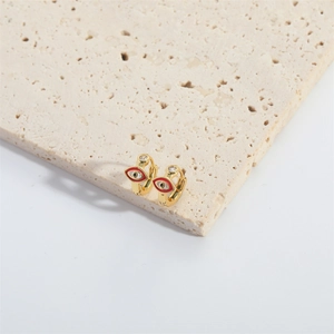 French vintage evil eye hoop earrings with red enamel and clear gemstone on stone base