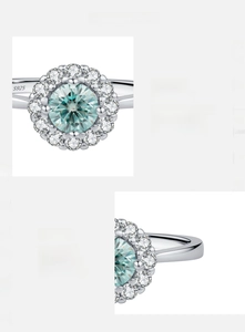 Macro shot of 925 silver halo ring featuring D color VVS1 blue-green moissanite detail