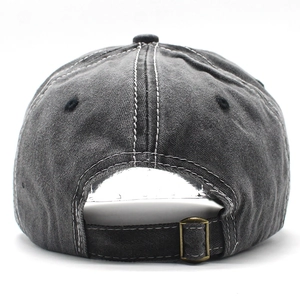 Detail view of adjustable metal buckle and contrast stitching on dark grey baseball cap