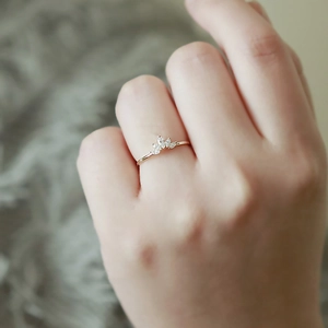Elegant s925 silver crown ring with marquise cut gemstones worn on hand in close-up