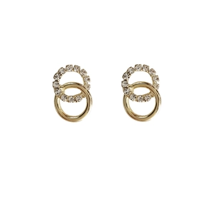Elegant gold intertwined hoop earrings with sparkling white crystals on white background