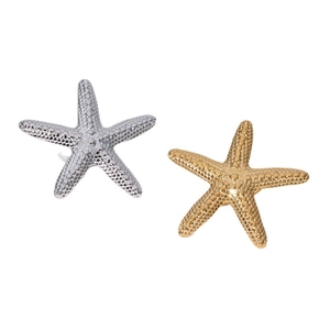 Minimalist 18k gold and silver starfish ring set with textured finish on white background