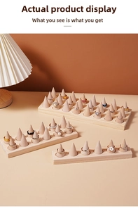 Detailed view of wooden conical ring display stands with multi-row minimalist storage