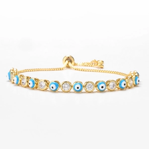 Detail of adjustable evil eye bracelet with blue enamel and micro-paved zircons